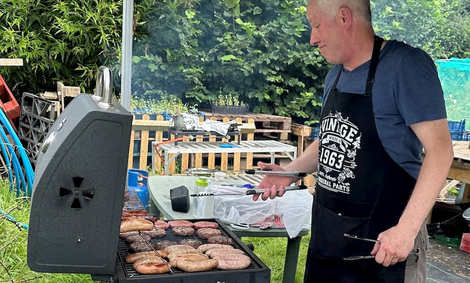 Man BBQing at the Community event